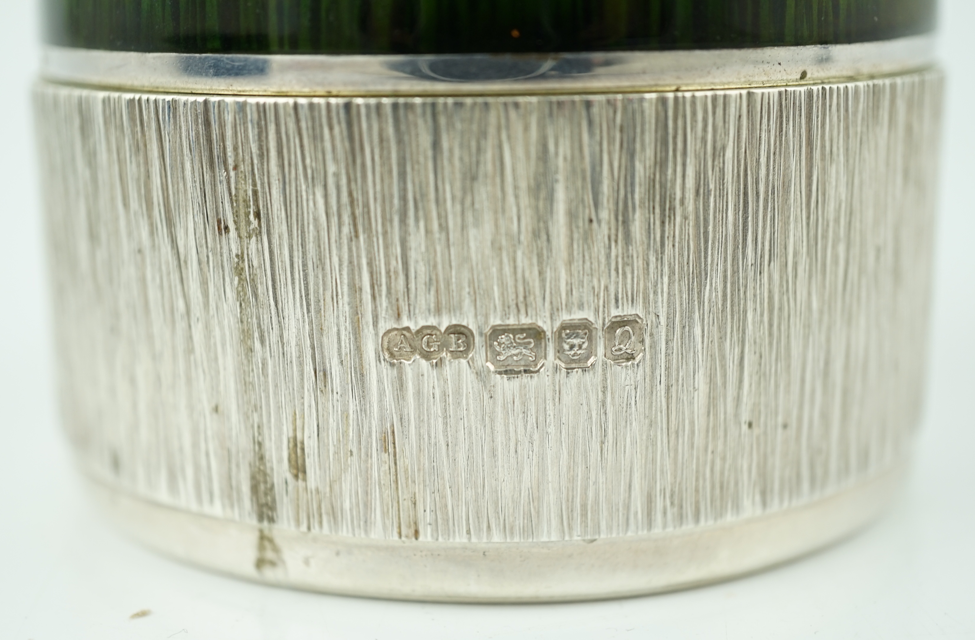 An Elizabeth II textured silver and green enamelled circular box and cover by Adrian Gerald Benney